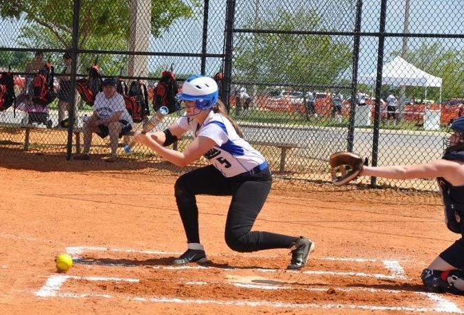 Ellie Schneider (Freshman New Ulm) executes a bunt during the last game against Northland Community and Technical College.