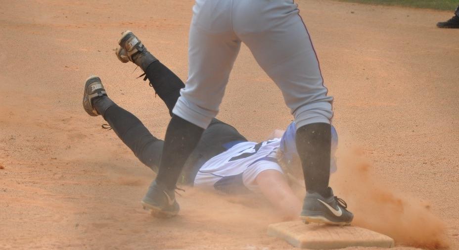 Trena Larson (Sophomore Prior Lake) diving back to 1st as a line drive was caught by the 2nd baseman.