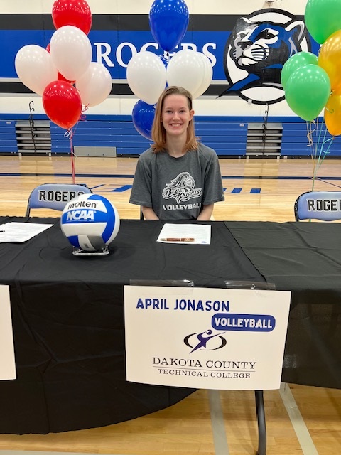 Blue Knights Volleyball Signs April Jonason from Rogers HS